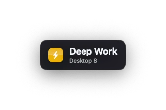 The switch tag: a dark rounded panel with the desktop’s icon, the name Deep Work and its desktop number beneath it.